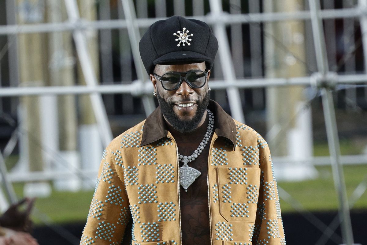 A photo of Burna Boy at the Louis Vuitton Spring/Summer 2025 menswear ready to wear presentation as part of Paris Fashion Week in Paris on June 18, 2024
