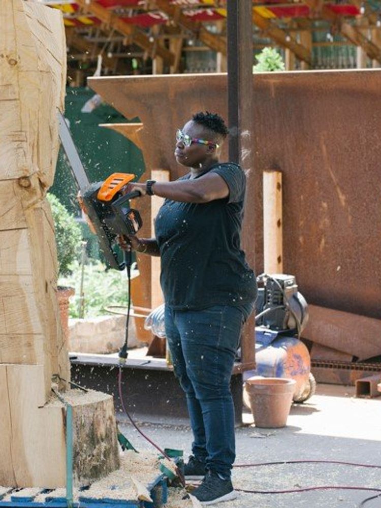 A Photo of Leilah Babirye working on a sculpture project.