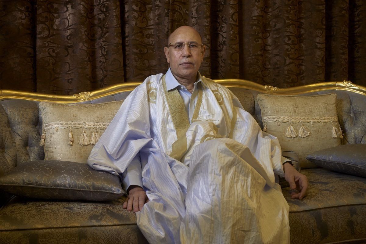 A photo of Mauritanian President  Mohamed Ould Ghazouani poses for a portrait while sitting on a chair.