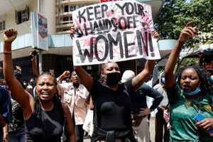 Activists chant slogans and hold placards as they take part in a march against femicide and gender-based violence in Nairobi, on December 10, 2024.