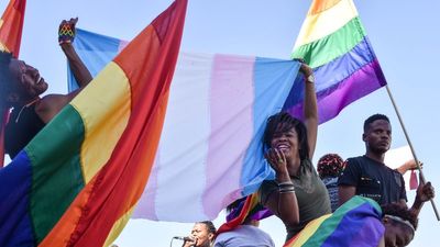 Dozens of people cheer and dance as they take part in the Namibian Lesbians, Gay, Bisexual and Transexual (LGBT) community pride Parade in the streets of the Namibian Capitol on July 29, 2017 in Windhoek.