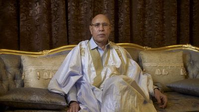 A photo of Mauritanian President  Mohamed Ould Ghazouani poses for a portrait while sitting on a chair.