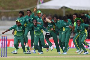 Nigerian women's cricket team jumping in celebration after historic World Cup win.