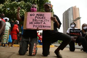 Two young residents of Mathare slums holding a placard during the demonstrations against police brutality on June 9, 2020.