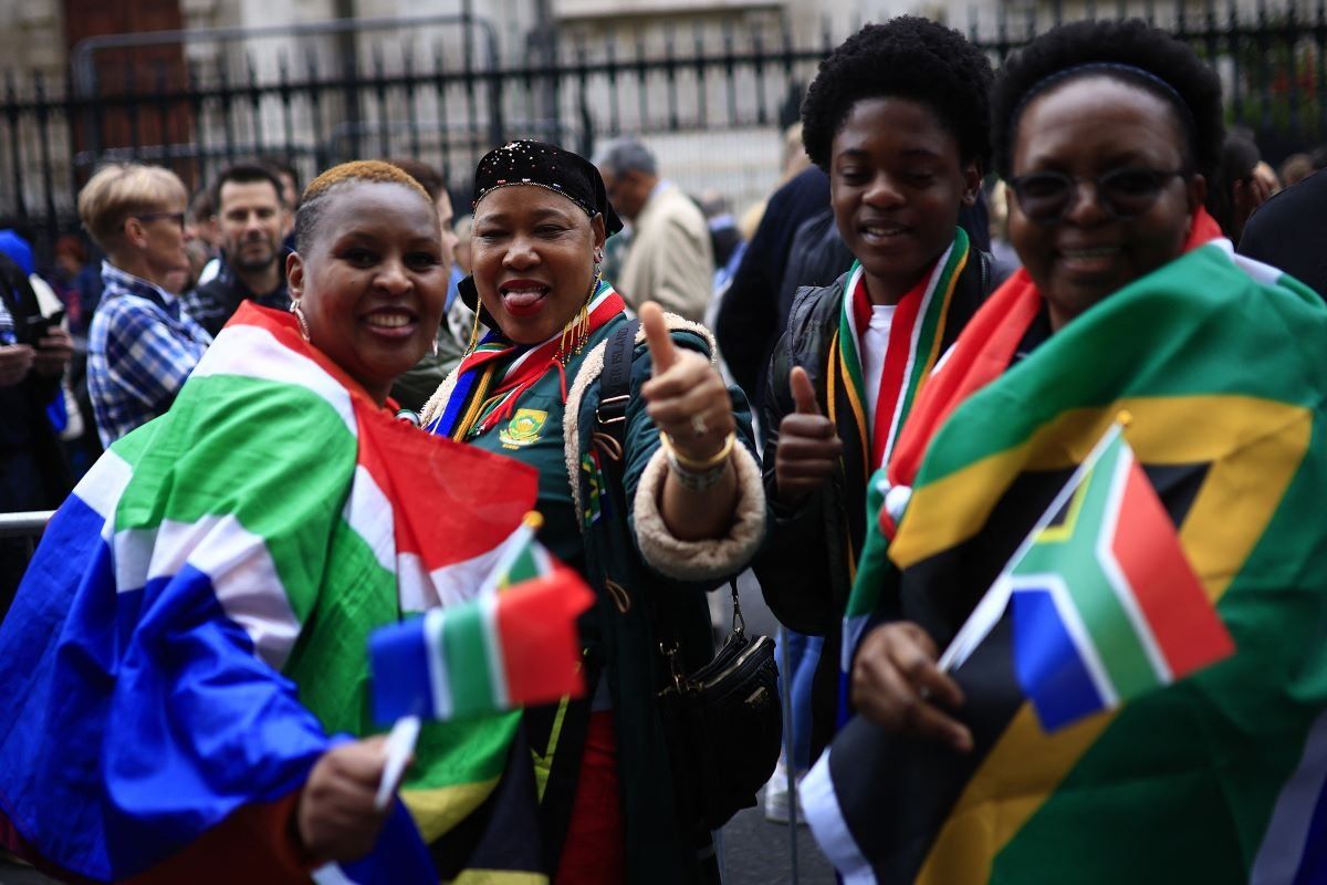 People queue outside of the South African High Commission in central London on May 18, 2024, to vote in South Africa's forthcoming general election. 